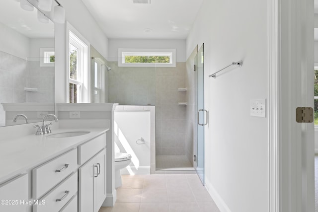 bathroom with vanity, toilet, an enclosed shower, and tile patterned flooring