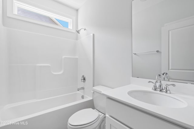 full bathroom with vanity, tub / shower combination, and toilet