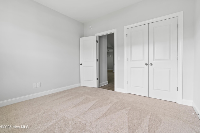 unfurnished bedroom featuring a closet and carpet