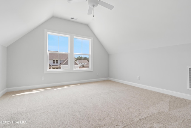 bonus room with lofted ceiling, carpet flooring, and ceiling fan