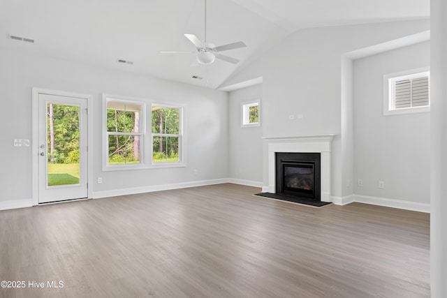 unfurnished living room featuring ceiling fan, lofted ceiling, and wood-type flooring