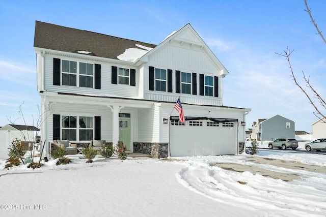 view of front facade featuring a garage and covered porch