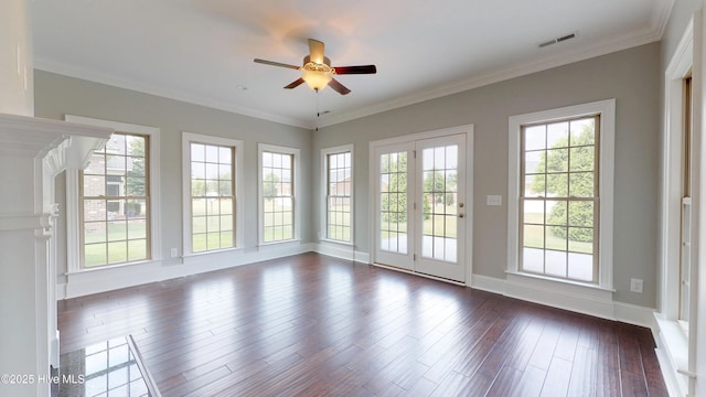 empty room featuring crown molding, dark hardwood / wood-style floors, and ceiling fan