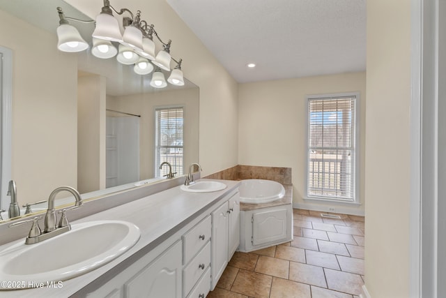 bathroom featuring an inviting chandelier, shower with separate bathtub, a textured ceiling, vanity, and tile patterned flooring