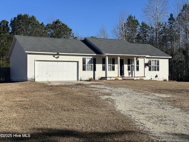 ranch-style home with a porch and a garage