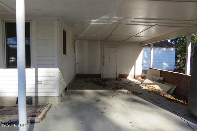 view of patio / terrace featuring an attached carport