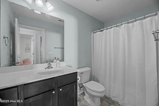 bathroom featuring a shower with curtain, toilet, tile patterned floors, and vanity