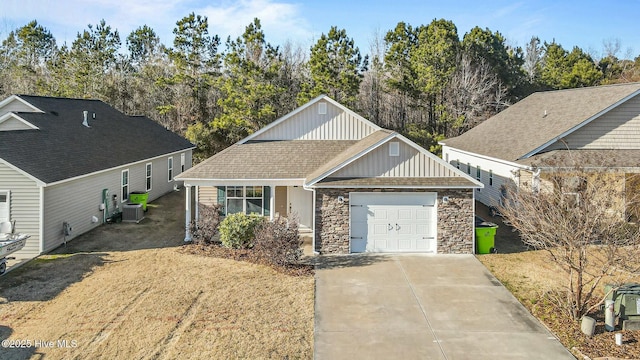 view of front of home with central AC and a garage