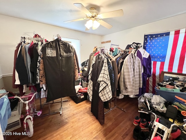 spacious closet with ceiling fan and wood-type flooring