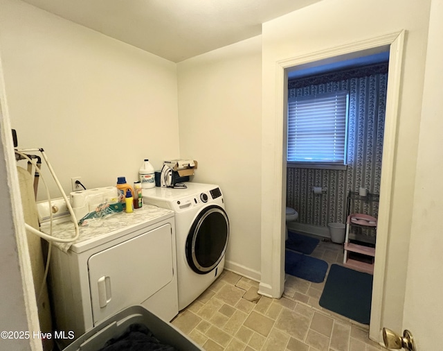 washroom featuring washing machine and clothes dryer