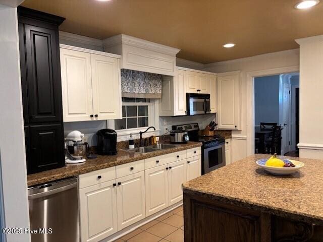 kitchen with white cabinetry, appliances with stainless steel finishes, and sink