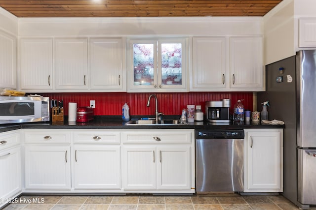 kitchen featuring sink, white cabinetry, appliances with stainless steel finishes, and wood ceiling