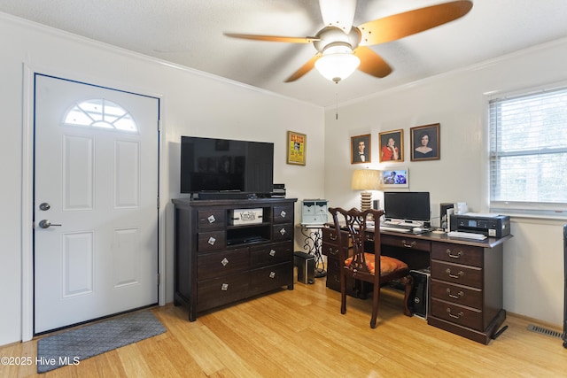 office featuring light wood-type flooring, ceiling fan, and ornamental molding