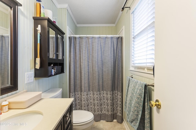 bathroom featuring vanity, toilet, wood walls, and ornamental molding