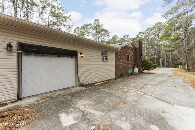 view of side of property featuring a garage