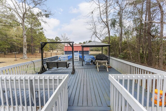 wooden deck with a gazebo