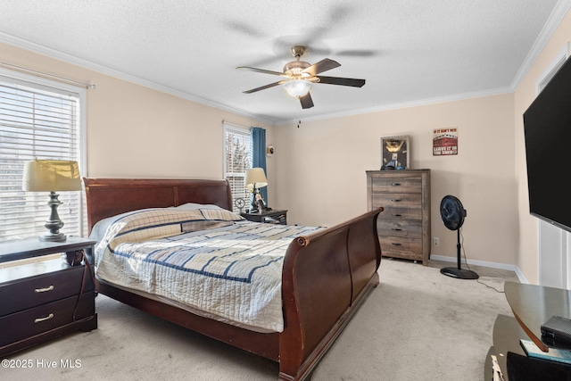 carpeted bedroom featuring crown molding, ceiling fan, and a textured ceiling