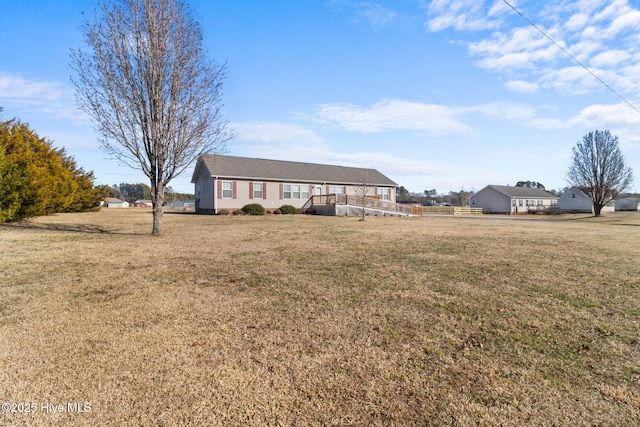 single story home with a front lawn