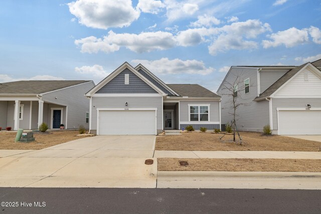 view of front of home with a garage and a front yard