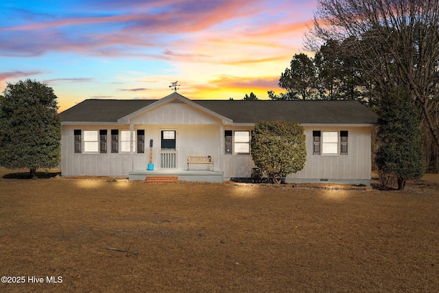 ranch-style house featuring a yard