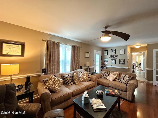 living room with wood-type flooring and ceiling fan