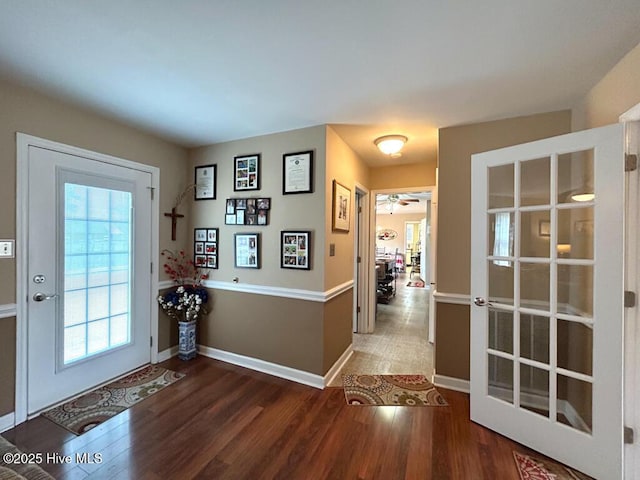 entryway with hardwood / wood-style floors