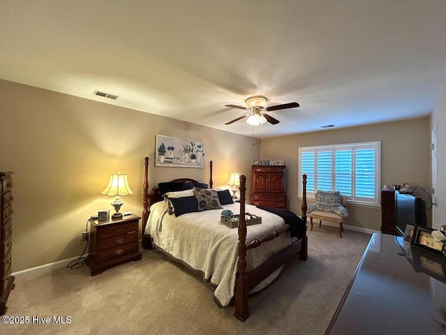 bedroom with ceiling fan and carpet flooring