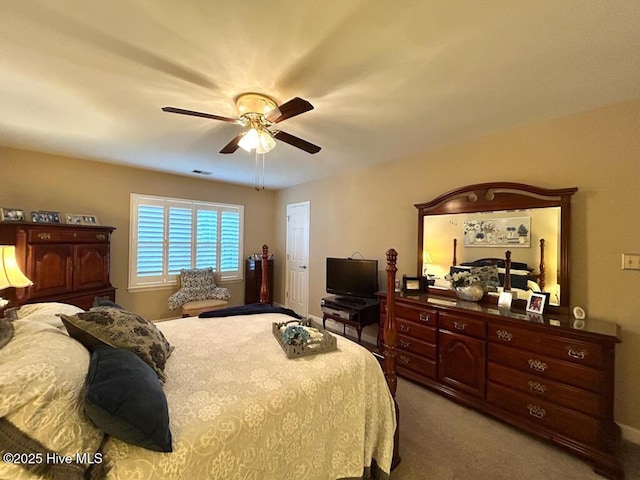 bedroom featuring light colored carpet and ceiling fan