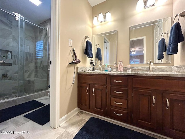 bathroom with vanity and a shower with shower door