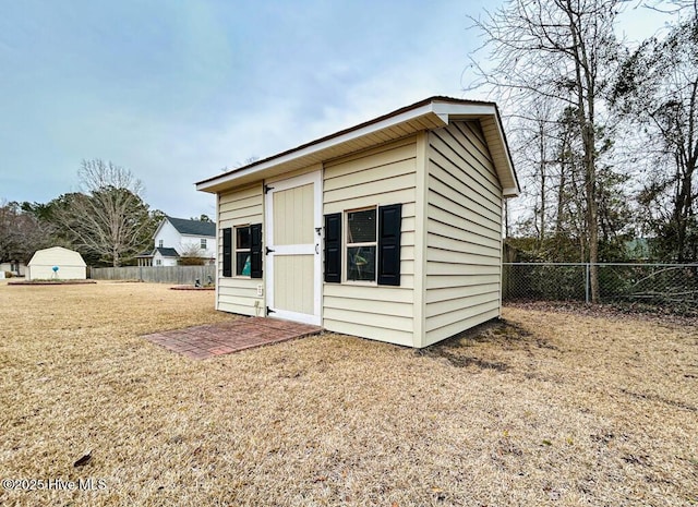 view of outbuilding with a lawn