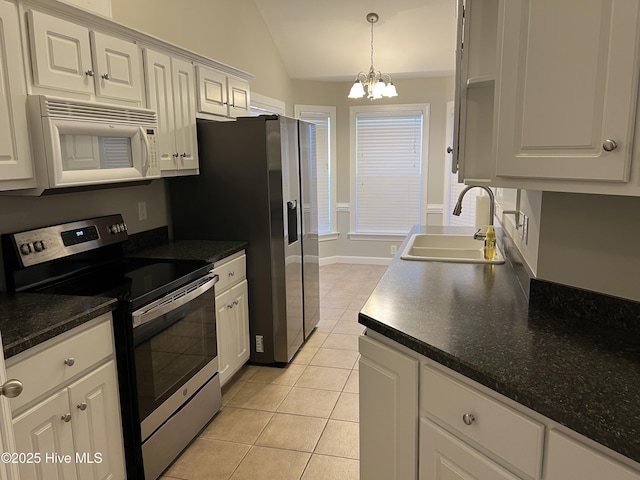 kitchen featuring sink, white cabinetry, appliances with stainless steel finishes, and light tile patterned flooring