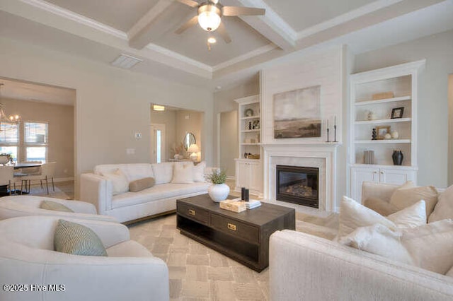 living room with built in shelves, coffered ceiling, ceiling fan with notable chandelier, and beam ceiling