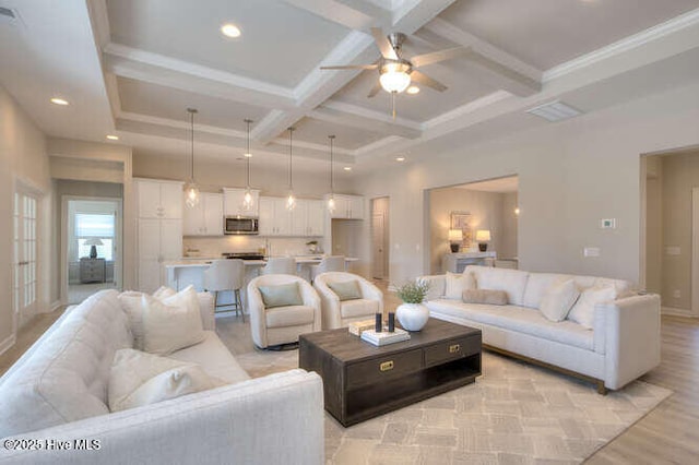 living room featuring beamed ceiling, coffered ceiling, and light wood-type flooring