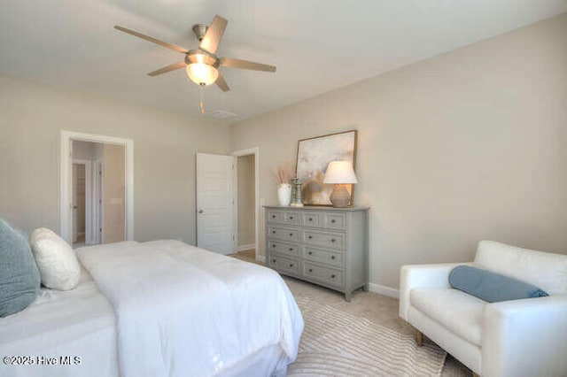 bedroom with light carpet and ceiling fan