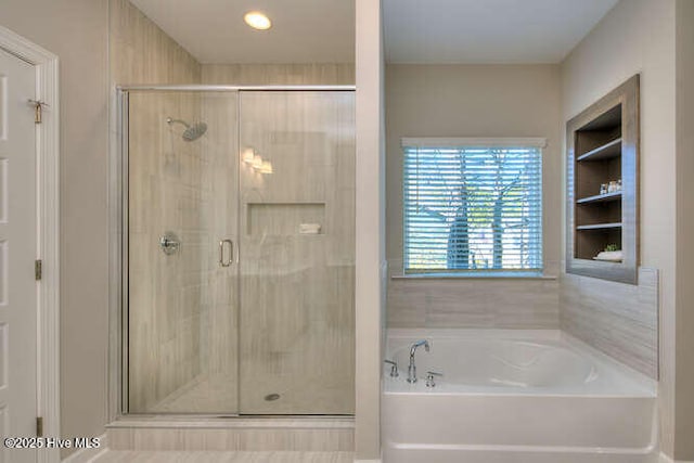 bathroom featuring plus walk in shower