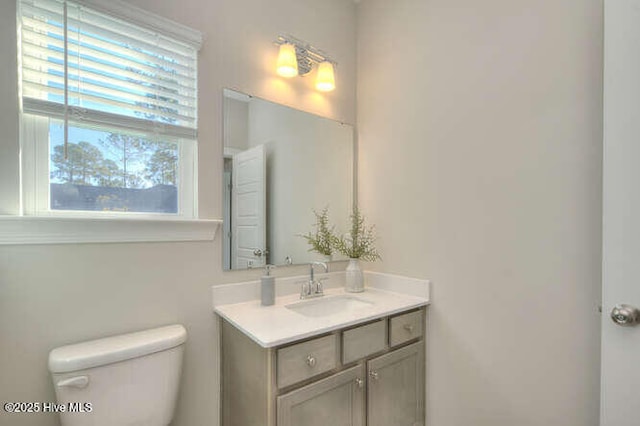 bathroom with vanity and toilet