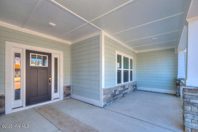 doorway to property with a porch