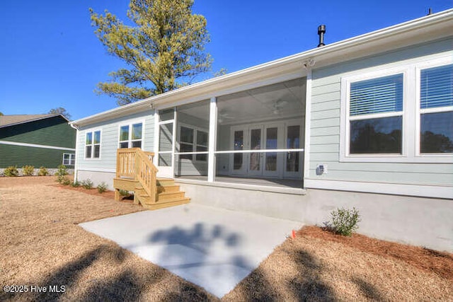 back of house with a patio and a sunroom