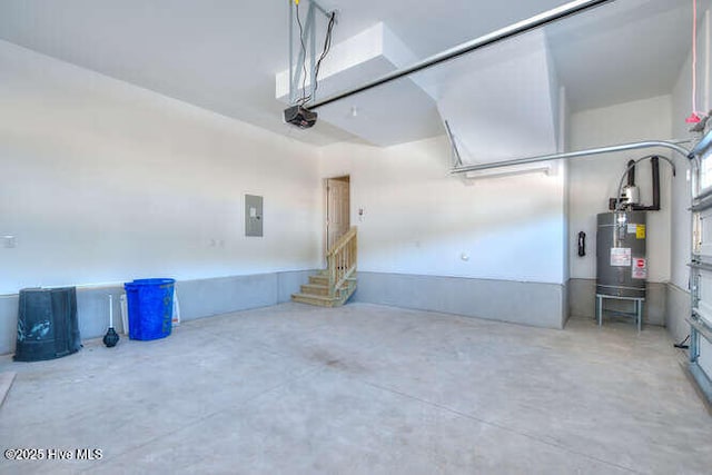 garage with a garage door opener, electric panel, and water heater