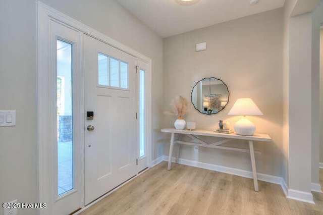 foyer entrance featuring plenty of natural light and light wood-type flooring