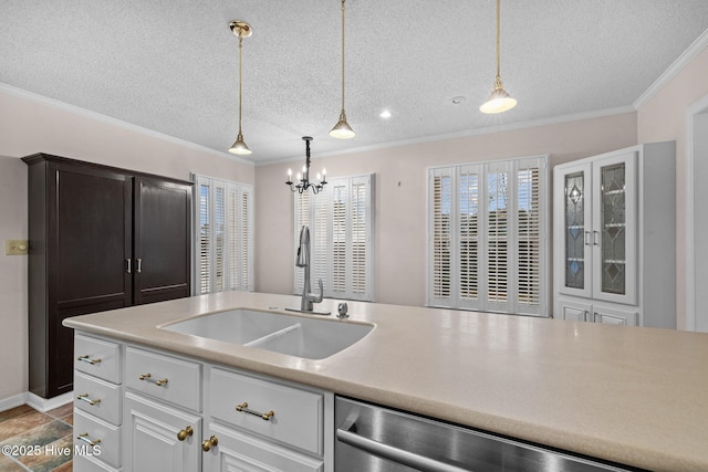 kitchen with sink, white cabinetry, ornamental molding, a textured ceiling, and stainless steel dishwasher