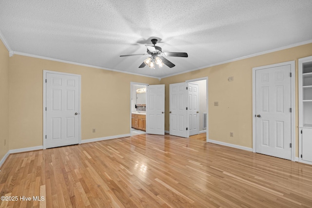 unfurnished bedroom with light hardwood / wood-style flooring, ceiling fan, connected bathroom, ornamental molding, and a textured ceiling