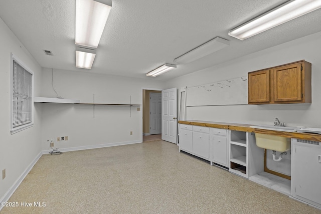 basement featuring a textured ceiling