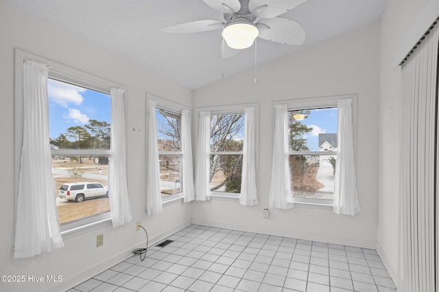 unfurnished sunroom featuring lofted ceiling and ceiling fan