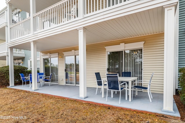 view of patio featuring a balcony