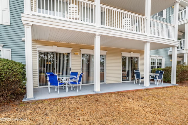 back of property with a patio