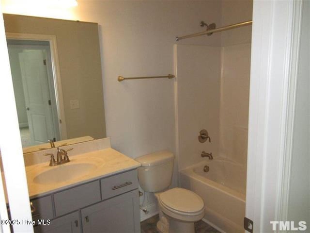 full bathroom featuring vanity, shower / washtub combination, and toilet