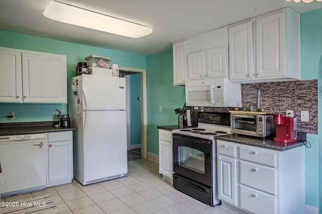 kitchen featuring white cabinetry, white appliances, and tasteful backsplash