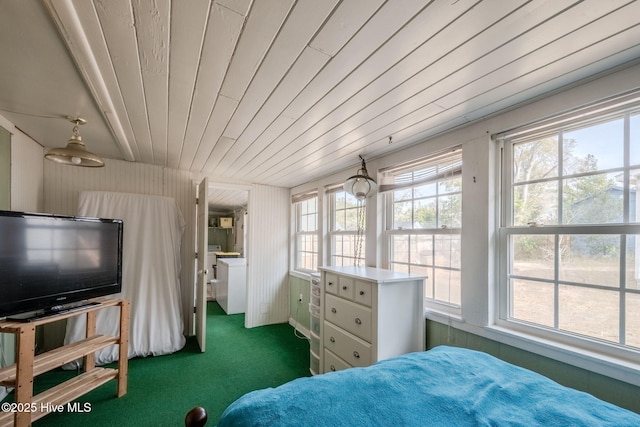 carpeted bedroom featuring multiple windows and wood ceiling