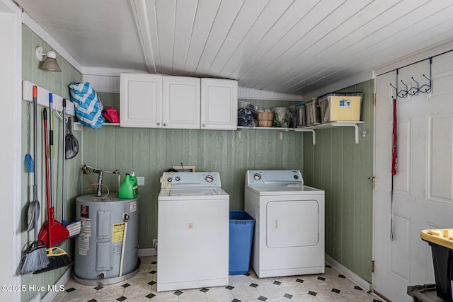 laundry room featuring washer and dryer, cabinets, wood ceiling, crown molding, and electric water heater